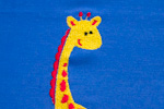 Lze vyšít i menší žirafu v rámečku 10 x 10 cm